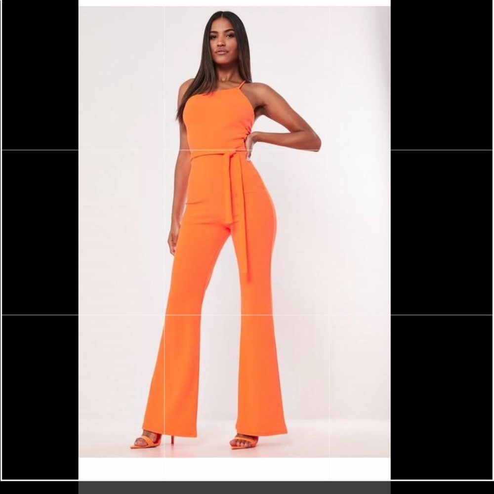 NEON ORANGE ASYMMETRIC BANDEAU FLARE LEG JUMPSUIT